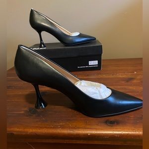 Black pumps, new in box.